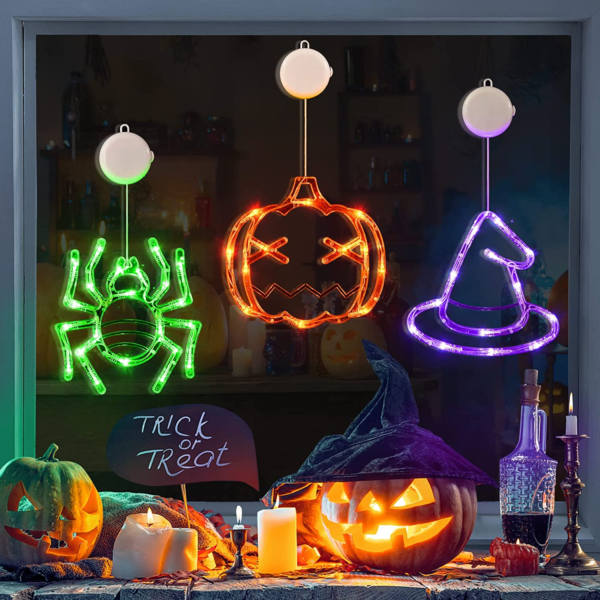 "Spooky AF Halloween Decorations Trio: Orange Pumpkins, Green Spiders, and a Witch Hat"